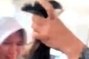 Rekaman video viral menayangkan siswi SMKN 2 Garut, menjerit menangis karena rambutnya dicukur paksa oleh guru .(Foto: Istimewa)